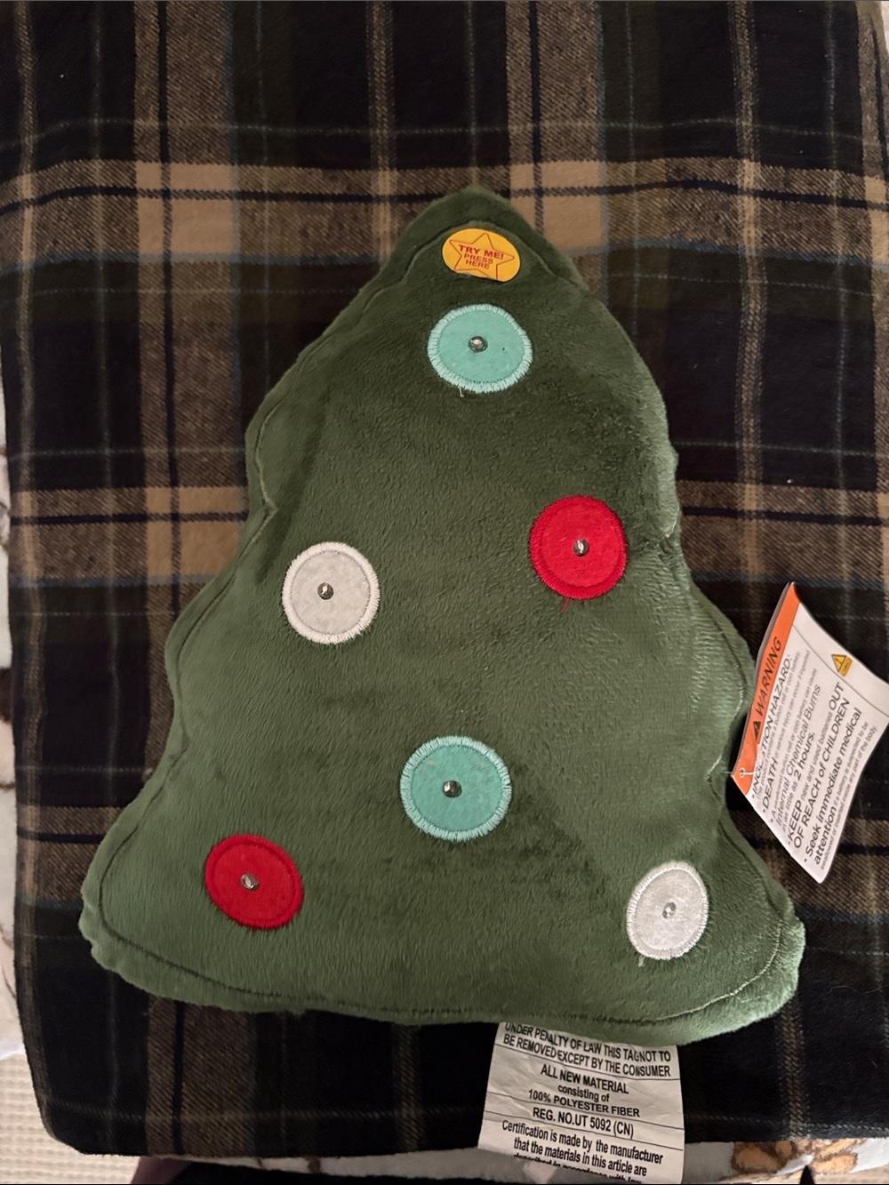 Glowing Christmas tree plush glows when button is pressed